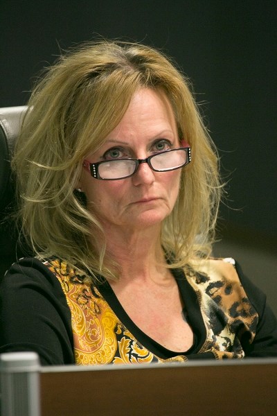 Former Coun. Jodi Orr, pictured here in a file photo listening attentively during a past meeting, recently resigned. Town officials have begun the byelection process.,