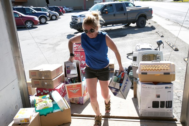 SUNDRE RESIDENTS STEP UP FOR FORT MCMURRAY — Kaylin Orr loads donated items into a trailer in the parking lot in front of Pharmasave on the afternoon of Friday, May 6. The