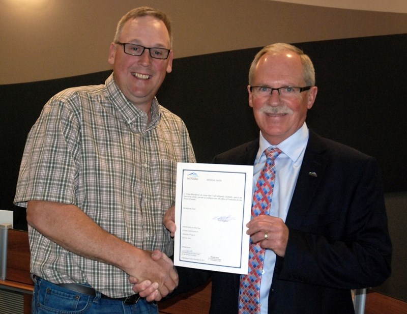 Mayor Terry Leslie, right, welcomed council&#8217;s newest member, Nolan Blatchford, at the June 27 meeting, who was recently elected in a byelection following the