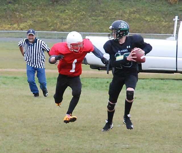 Sundre Bison Evyn Read managed to gain some yardage against the Bowden Blazers before being tackled during a home game on Saturday, Oct. 1.,