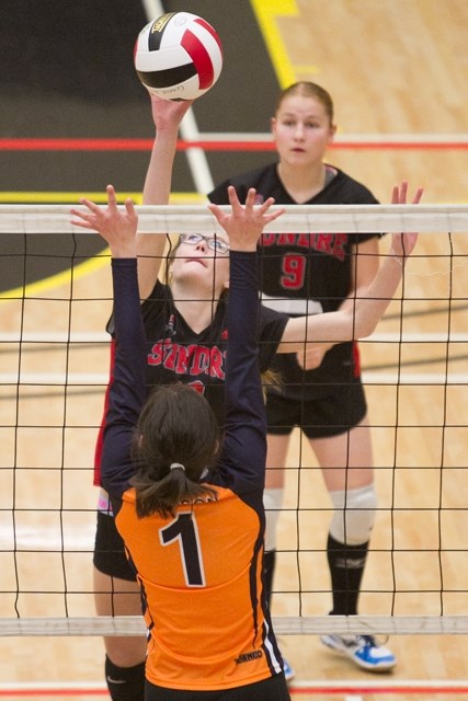 Sundre High School Scorpions senior volleyball player Toni Pedersen spikes the ball during the Scorpions&#8217; game against the W.H. Croxford Cavaliers at Olds High School