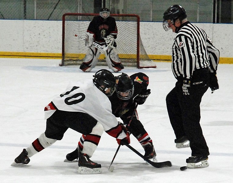 Sundre peewee A Husky goaltender Jaxson Schmaltz keeps his eyes on the puck as it sails past his net on home ice during the second game in a best-of-three playoff series