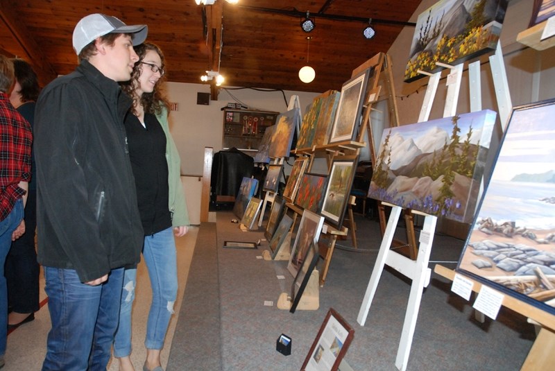 Kyle and Jenna Knelsen, a married couple from Sundre, were among many people to check out the work on display during last year&#8217;s annual art show and sale held at the