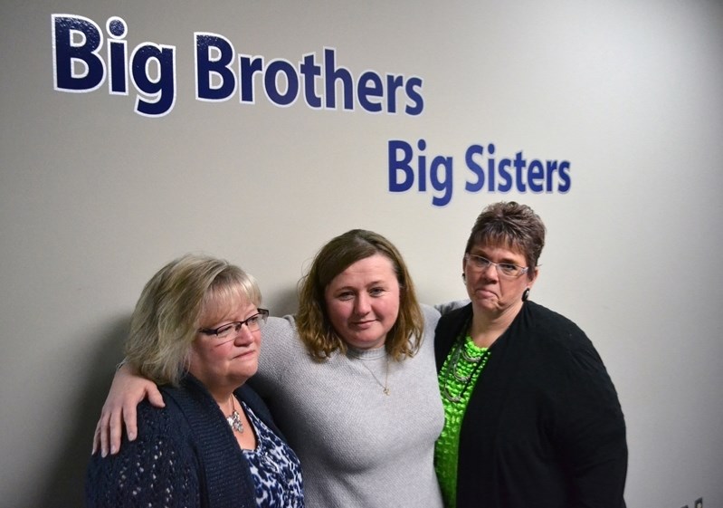 Sadness at Big Brothers Big Sisters of Prairies to Peaks as the agency for youth will close its doors after 30 years of service. From left to right is Lucille