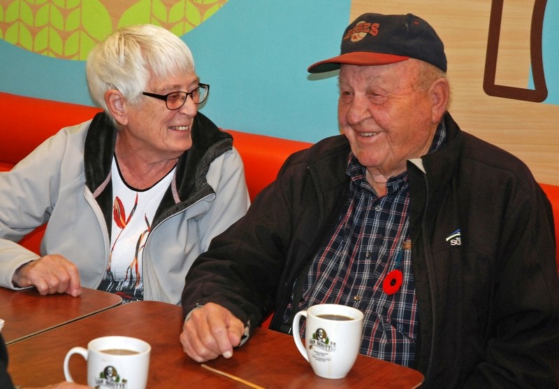 Former councillor Myron Thompson, pictured up front with his wife Dot, was recognized during the outgoing council&#8217;s last meeting before the election for his 52 years of 