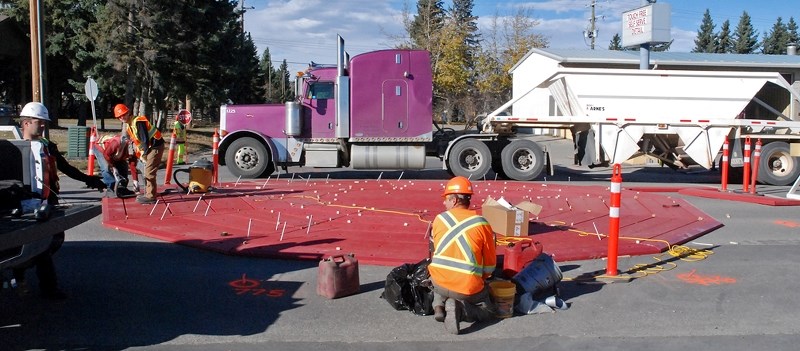 Even when workers were installing the new roundabouts, large trucks such as this semi seemed to effortlessly navigate the traffic calming measures.