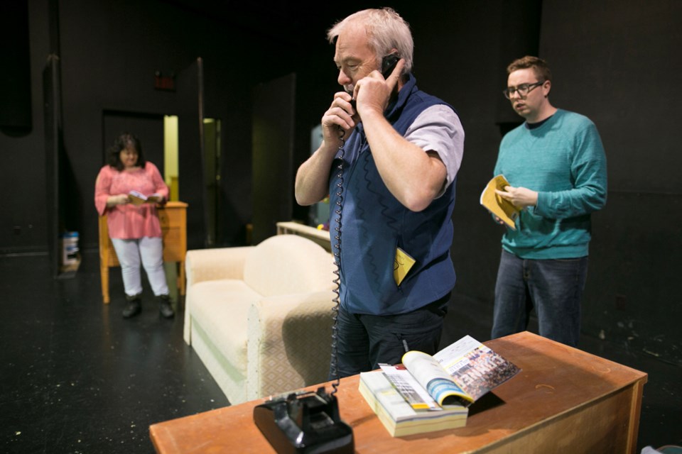 From left, Peak Theatre Players members Michelle Engelman, Neil Enbleton and Patrick Monaghan rehearse a scene for the group&#8217;s upcoming performance of Lend Me a Tenor