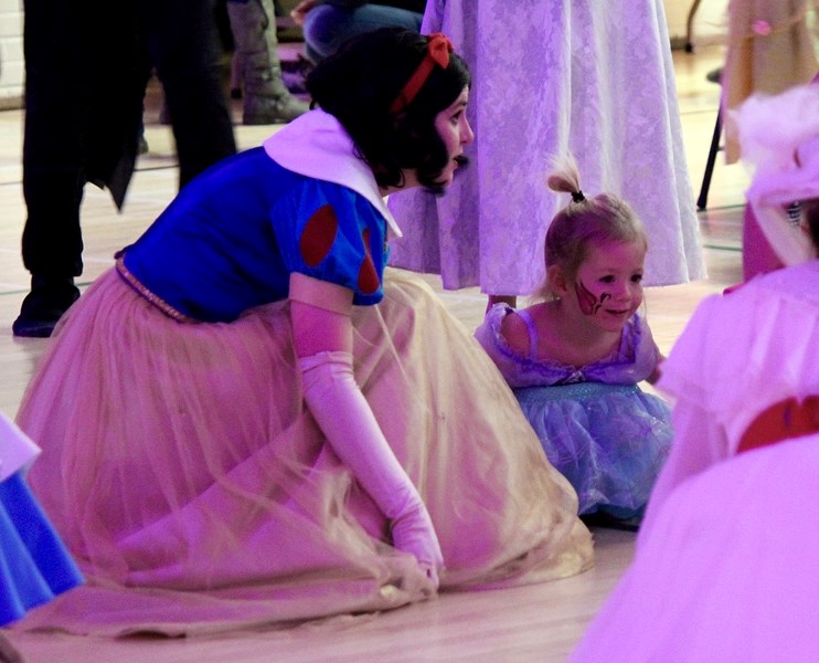 Beauty and the Beast&#8217;s Belle shares a dance with one of about 100 children who attended the recent Superhero and Princess Ball at the Sundre Community Centre.