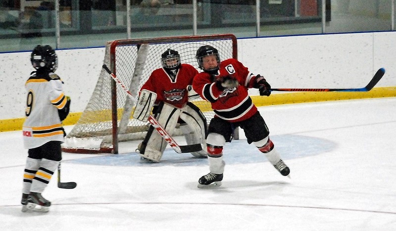 Sundre atom Huskies captain Payton Martyn blocks an incoming shot during the first game of the local team&#8217;s home tournament held at the Sundre Arena on Dec. 1-3.