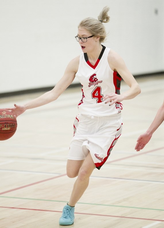 Sundre High School Scorpions basketball player Toni Pedersen drives to the hoop during the Scorpions&#8217; game against the Didsbury Dragons in Sundre on Dec. 13.