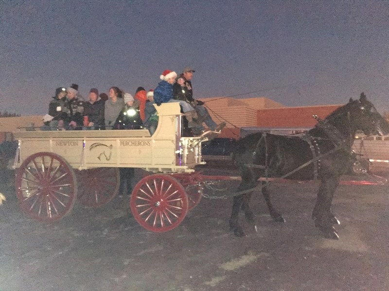 Pictured embarking on the 14th annual 4-H and Sundre Search and Rescue food drive on the evening of Dec. 7 is one of the three horse and wagon teams that transported local