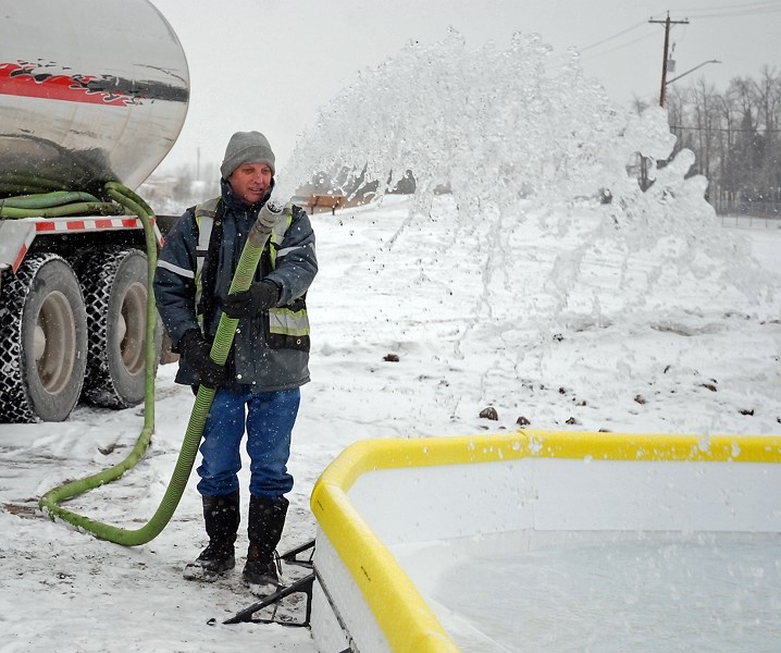 RETURN OF THE RINK ó Town of Sundre employee Keith Worrall floods the outdoor rink next to the Sundre Skatepark on Tuesday, Dec. 19.