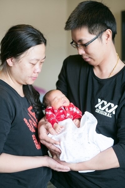 Yanna Tan, left, and her husband Dongnian &quot;Tony&quot; Wu hold their newborn daughter on Jan. 18. Abby Wu Tan was delivered at the local hospital on Saturday, Jan. 6 to