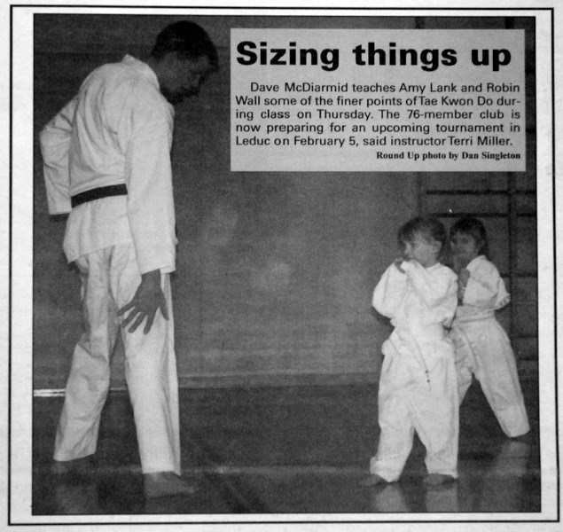 Tae Kwon Do instructor Dave McDiarmid teaches Amy Lank and Robin Wall some techniques during a class. The 76-member club was busy preparing for an early February tournament