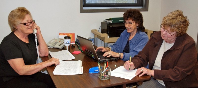 From left, Sundre and area residents Jean Hague, Joan Harris and Audrey Bressler were busy last year volunteering at the Greenwood Neighbourhood Place board meeting room to