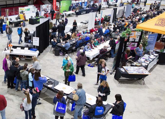 People browse through the booths in the arena during Neighbours&#8217; Day