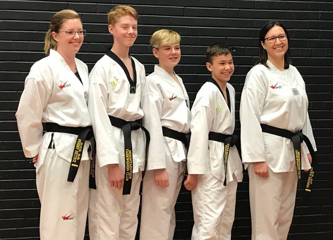  From left, Sandra Hillock, Hunter Hillock, Tristan Hillock, Brenden Johnson and Cherie Johnson all passed their black belt tests during the Mountainview Taekwondo Club’s test day on Saturday, April 13 at the Sundre Community Centre.