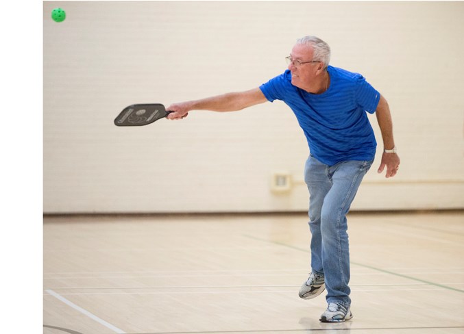 John Wind returns the ball during the session.