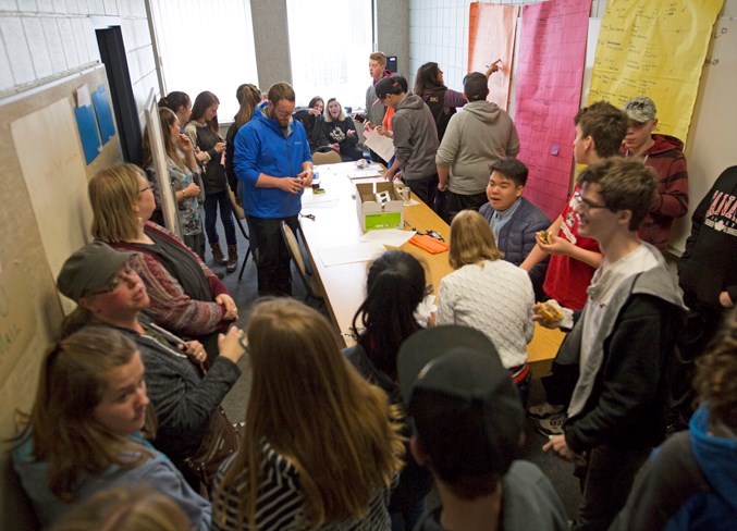  Students and staff get organized ahead of tackling the day's jobs. Noel West/MVP Staff