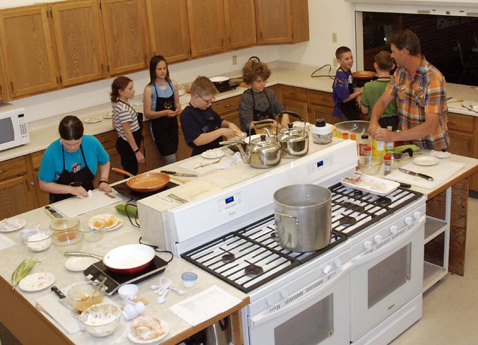  Certified chef Cal Werezak, who earned his Red Seal through SAIT's culinary program, taught a group of about a dozen children how to cook up some Louisiana style fried chicken at the Sundre Royal Canadian Legion Branch #223's kitchen during the last monthly Kids in the Kitchen before the summer break.