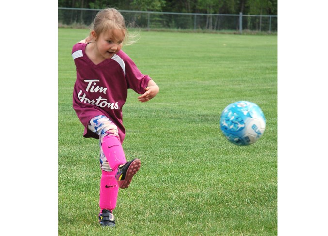  Amelia Giesbrecht kicks a ball last Wednesday during a drill on the soccer fields near the Sundre Legion off the Bergen Road.