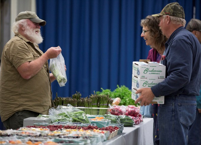 Bob Baker sells produce during the market.