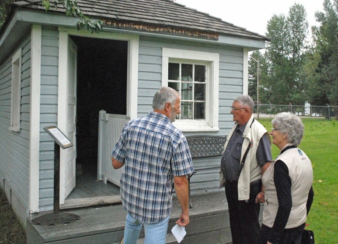  Communities in Bloom judges Bob Côté, centre, and Lorna McIlroy toured around the community on Wednesday, Aug. 8, including among the many stops a guided visit at the Sundre and District Museum’s picturesque pioneer village with interim director William Davies.