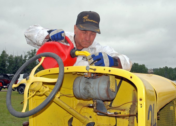  Ken Hotte, from Ardrossan, located east of Edmonton, fuels up carefully to avoid spilling a drop of gas on Saturday ahead of the Model T races. It was his first time competing in Sundre’s event, and he was one of 10 racers, including his son Matt Hotte, which was double the number of the past few years.