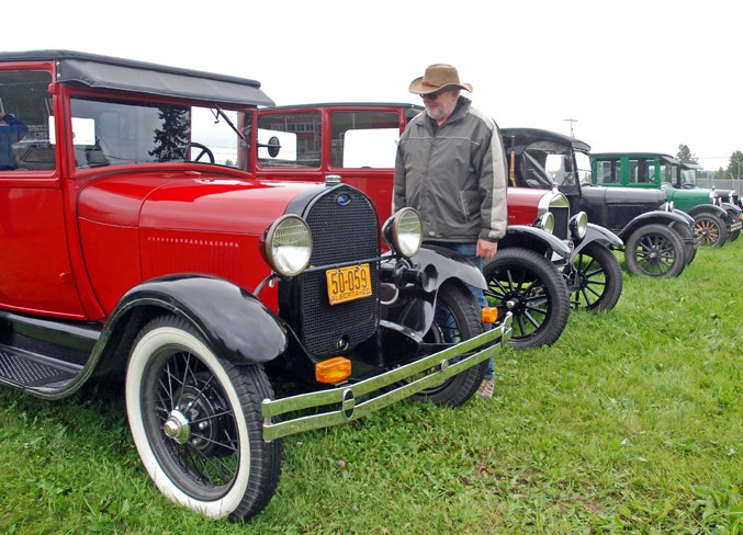  Self-professed car racing fan Ken Pootz, who recently retired and lives in Calgary but enjoys spending time at a cabin in Bergen Springs he and his wife purchased about four years ago, enjoyed on Saturday a chance to check out some vintage vehicles, including this Ford, before the Model T races.