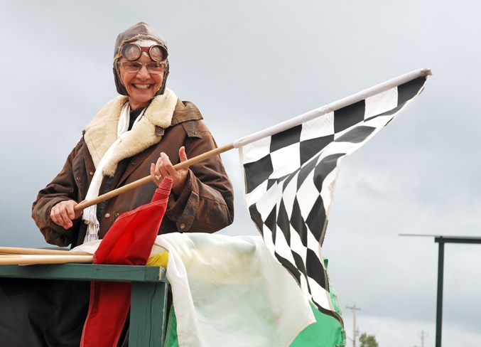  Rosalie Lillo, from Chestermere, waves the checkered flag, marking the final lap of one of several heats. Her husband Harry was among the racers.