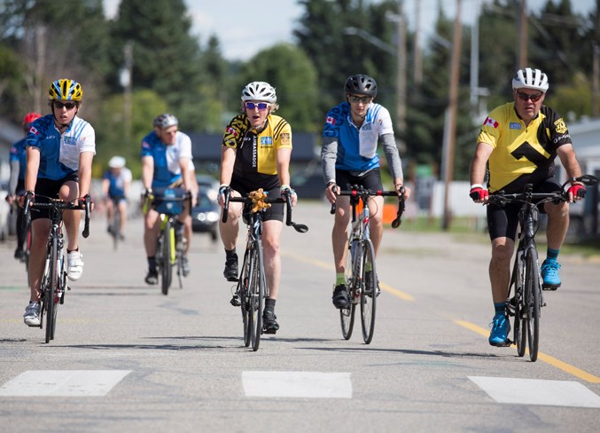  A group of riders make their way through Sundre on Saturday afternoon during the 11th annual Alberta Ride to Conquer Cancer.