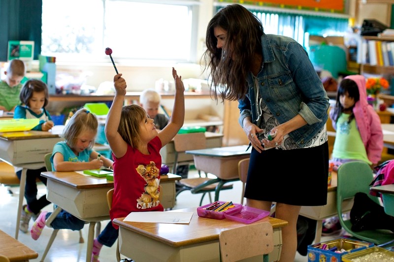 Grades 1 and 2 teacher Jaynee Gilbreath helps her students get ready for a new year of learning at Reed Ranch School.