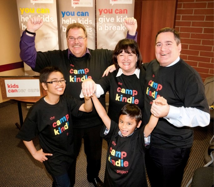 (Front row L-R) Johann and her little brother Jaiyann joined Christine McIver (centre) of Kids Cancer Care in thanking Dan Holinda (left) of the Canadian Cancer Society