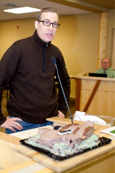 Bill Lough appears before P&amp;P with his gift of a cake shaped in the likeness of a skatepark.