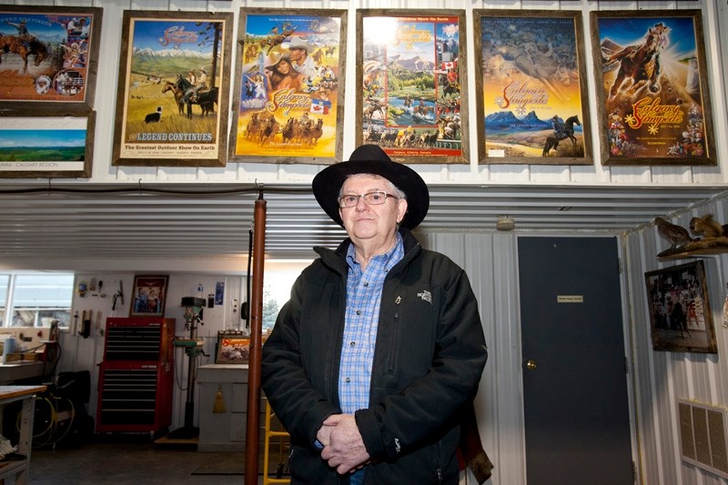 Harry Drever with some of his collection of Calgary Stampede posters in his shop just outside of Olds last Thursday.