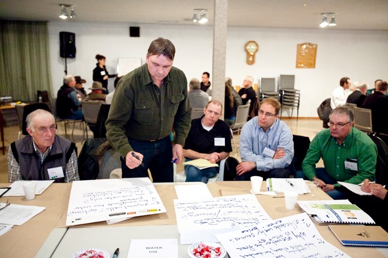 Participants get their thoughts transcribed by a SPOG representative during the meeting.