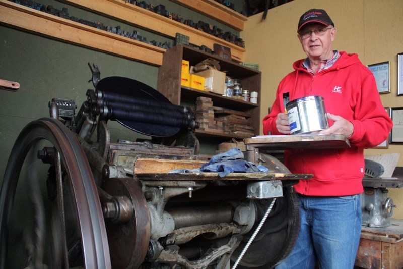 Ray Brinson shows off the working printing press that&#8217;s now stationed as part of a newspaper building at the Double Tree Village near Spruce View.