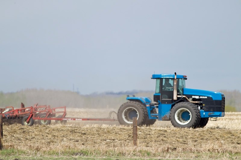 A farmer cultivates a field in the Rosebud area of Mountain View County. Agriculture officials estimated last week that about 90 per cent of the crop had been seeded in