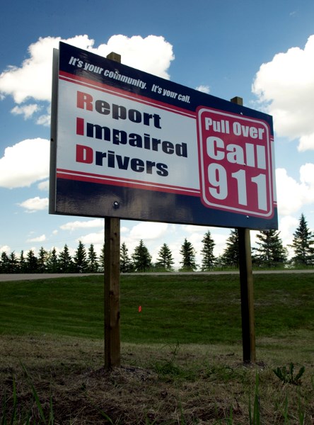 The new Report Impaired Drivers sign at the south end of Olds along Highway 2A.