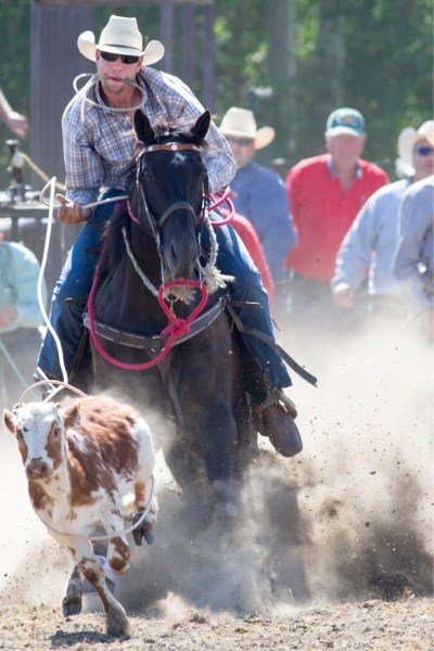 Wyatt Wilson of Rimbey gets his rope around a calf during the calf roping section of the 2012 Dogpound Rodeo at the Dogpound Rodeo grounds last Wednesday.