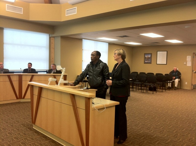 Electrification association represenatives (left to right) Glen Fox and Pat Bourne speak with MVC council on Dec. 5.