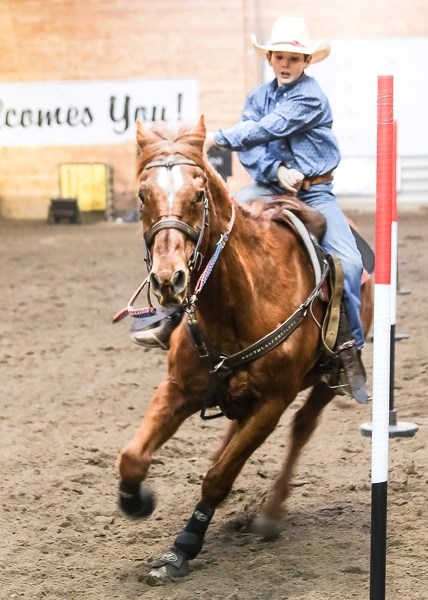 Joel Evans competes in the pole bending event at the recent Mountain View Cowpoke Junior Rodeo outside Sundre.