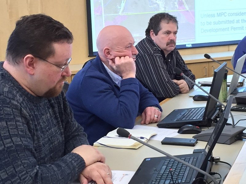 Municipal planning commission members Jeremy Sayer, left, Bruce Beattie and Dean Hedley take part in the commission&#8217;s Feb. 16 meeting.