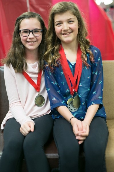 Hugh Sutherland School students Kaia Kennedy, left, and Brechin Pound at the school on March 15.