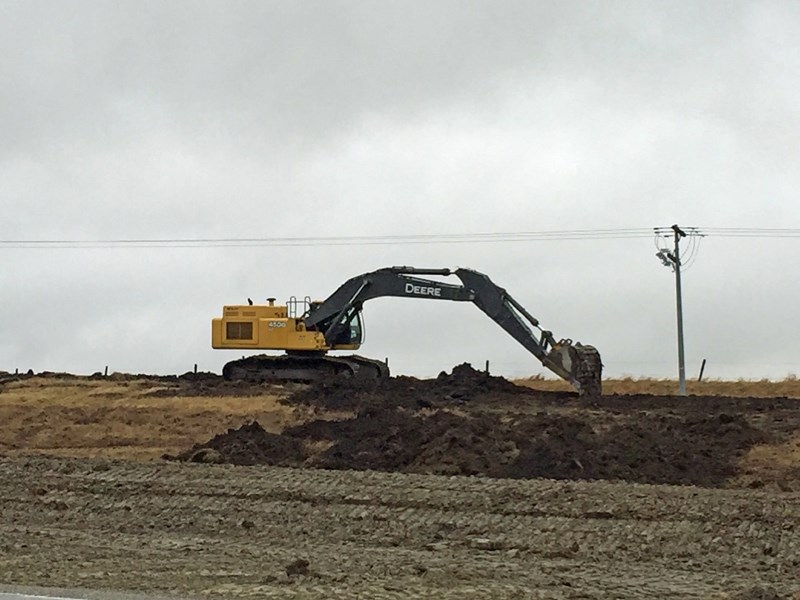 Crews work along Highway 27 just north of Cremona.