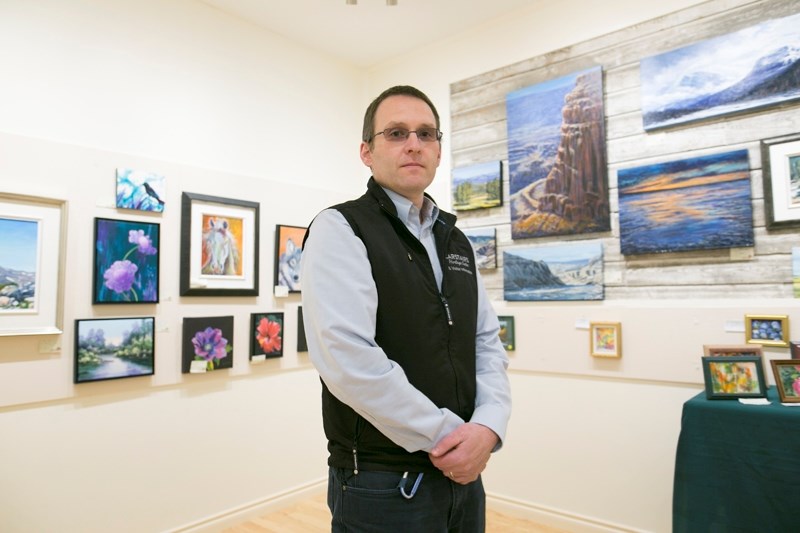 Carstairs Heritage Centre curator Michael Dougherty in an art exhibit space at the centre on June 1.