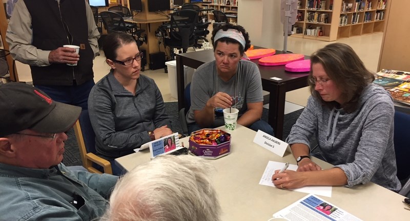 Division 5 councillor Angela Aalbers, right, speaks with guests at a Sundre candidate meet-and-greet event. Aalbers was elected to a second term on Oct. 16.