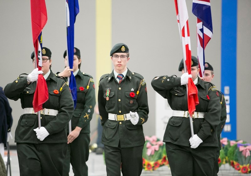 Members of the 3025 Didsbury Royal Canadian Army Cadet Corps march off the flags at the end of a Remembrance ceremony at Hugh Sutherland School in Carstairs on Nov. 7. Four