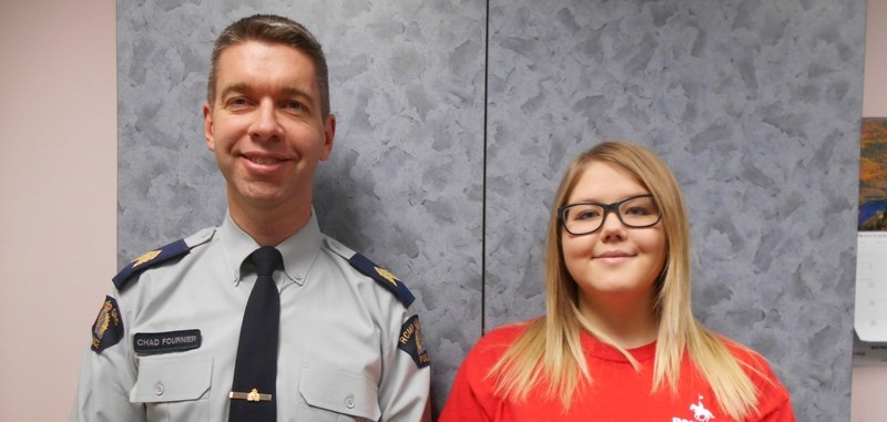 Didsbury RCMP Staff Sgt. Chad Fournier shares a smile with Kayla Kornicki of Carstairs, who was recently selected to the RCMP National Youth Advisory Committee.