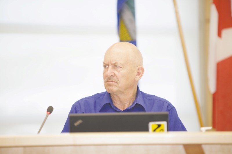 Reeve Bruce Beattie listens to council discussions.